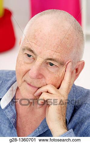 Pensive thoughtful senior man at home View Large Photo Image Stock Image - Pensive thoughtful senior man at home. Fotosearch