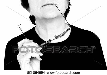 Picture - Pensive woman with glasses in hand. Fotosearch