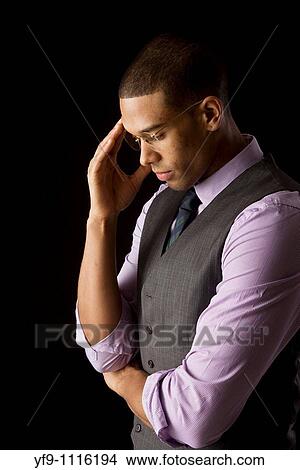 Pensive young businessman View Large Photo Image Picture - Pensive young businessman. Fotosearch