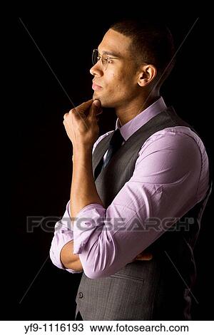 Pensive young businessman View Large Photo Image Stock Image - Pensive young businessman. Fotosearch