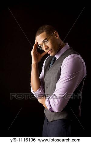 Pensive young businessman View Large Photo Image Stock Photograph - Pensive young businessman. Fotosearch