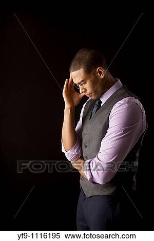 Pensive young businessman View Large Photo Image Stock Photography - Pensive young businessman. Fotosearch
