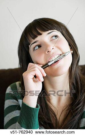 Pensive young woman in the couch View Large Photo Image Stock Image - Pensive young woman in the couch. Fotosearch