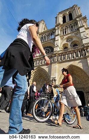 People and bicycle in front of Notre-Dame Cathedral.? le de la Cit?. Paris, France. View Large Photo Image Stock Image - People and bicycle in front of Notre-Dame Cathedral.? le de la Cit?. Paris, France.. Fotosearch