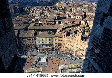 People and buildings in the Piazza del Campo seen from Torre del Mangia, Siena, Italy View Large Photo Image Stock Photography - People and buildings in the Piazza del Campo seen from Torre del Mangia, Siena, Italy. Fotosearch