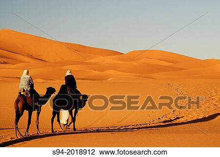People and dromedaries in Erg Chebbi desert near Merzouga, southeast Morocco. View Large Photo Image Stock Image - People and dromedaries in Erg Chebbi desert near Merzouga, southeast Morocco.. Fotosearch