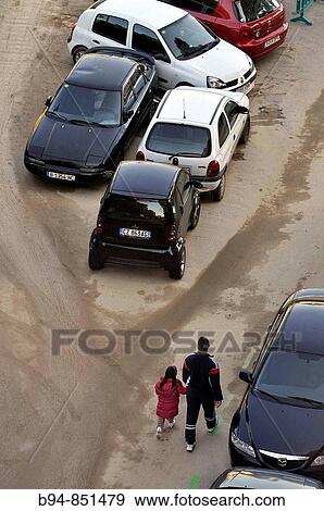 People and parked cars. Barcelona. Catalonia, Spain View Large Photo Image Stock Photo - People and parked cars. Barcelona. Catalonia, Spain. Fotosearch