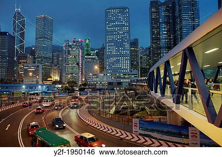 people and traffic pass through Central Hong Kong construction zone at dusk. View Large Photo Image Stock Photograph - people and traffic pass through Central Hong Kong construction zone at dusk.. Fotosearch