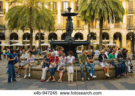 Stock Photography - People at the fountain at Placa Reial in central Barcelona Spain Europe. Fotosearch