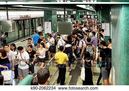 People at the MTR station, Hong Kong, China, East Asia. View Large Photo Image Picture - People at the MTR station, Hong Kong, China, East Asia.. Fotosearch