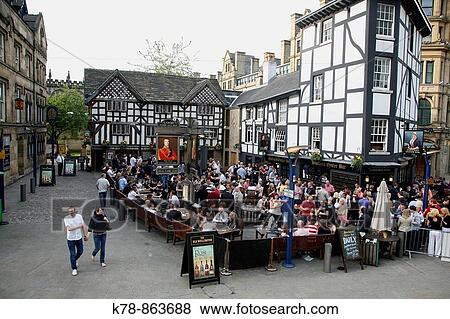 People at the Sinclairs Oyster Bar and the Wellington Inn restaurant, Manchester, England, UK View Large Photo Image Stock Photo - People at the Sinclairs Oyster Bar and the Wellington Inn restaurant, Manchester, England, UK. Fotosearch
