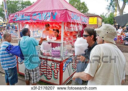 People buying cotton candy in an artistic concession booth. Minnesota State Fair St Paul Minnesota MN USA. View Large Photo Image Stock Photo - People buying cotton candy in an artistic concession booth. Minnesota State Fair St Paul Minnesota MN USA.. Fotosearch