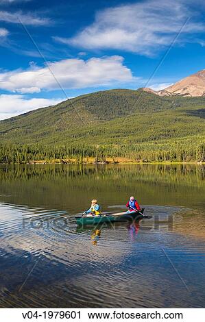 People canoeing on Pyramid Lake in the Jasper National Park, Alberta, Canada View Large Photo Image Stock Image - People canoeing on Pyramid Lake in the Jasper National Park, Alberta, Canada. Fotosearch