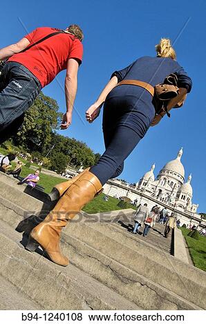 Stock Photo - People climbing stairs in front of the Basilica Sacr? -Coeur. Montmartre. Paris, France.. Fotosearch