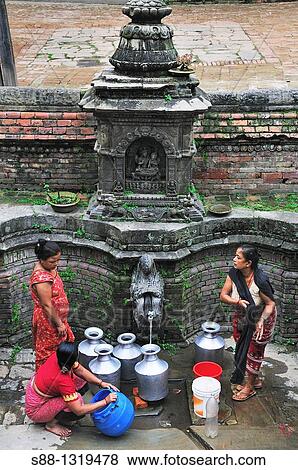 People come to get water at Durbar square, Bhaktapur (Bhadgaon), Kathmandu Valley, Nepal. View Large Photo Image Stock Photo - People come to get water at Durbar square, Bhaktapur (Bhadgaon), Kathmandu Valley, Nepal.. Fotosearch