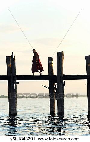 People crossing the U Bein bridge by dusk View Large Photo Image Stock Image - People crossing the U Bein bridge by dusk. Fotosearch