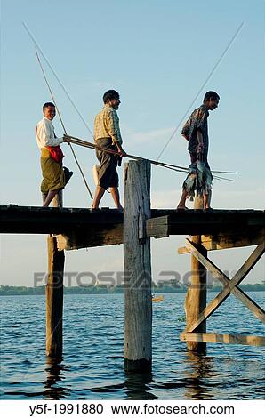 People crossing U Bein bridge at the end of the day. View Large Photo Image Stock Image - People crossing U Bein bridge at the end of the day.. Fotosearch