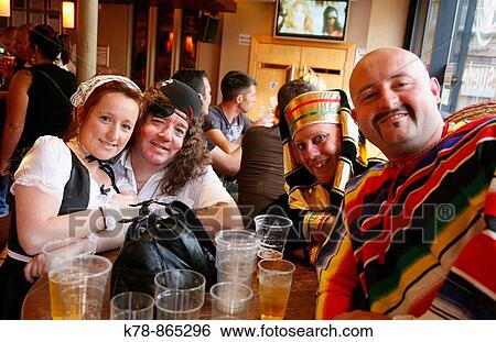 People dressed up in costume at a bar, Liverpool, England, UK View Large Photo Image Stock Photograph - People dressed up in costume at a bar, Liverpool, England, UK. Fotosearch
