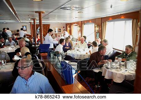 People eating on board the Clipper Adventurer cruise ship sailing in Greenland View Large Photo Image Stock Image - People eating on board the Clipper Adventurer cruise ship sailing in Greenland. Fotosearch