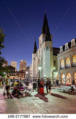 Stock Photo - People enjoy the Nightlife in Jackson Square with the Saint Louis Cathedral in the background.. Fotosearch