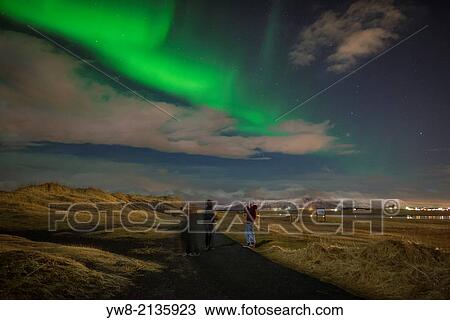People enjoying and photographing The Aurora Borealis or Northern Lights, Reykjavik, Iceland. View Large Photo Image Stock Image - People enjoying and photographing The Aurora Borealis or Northern Lights, Reykjavik, Iceland.. Fotosearch