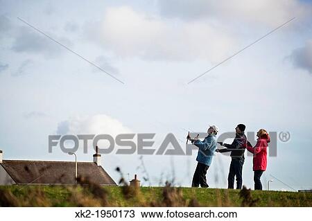 People flying kite View Large Photo Image Stock Image - People flying kite. Fotosearch
