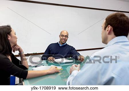 People having a meeting in a conference room View Large Photo Image Stock Photo - People having a meeting in a conference room. Fotosearch