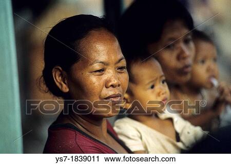 People in a boat along a river in central Java, Indonesia View Large Photo Image Stock Image - People in a boat along a river in central Java, Indonesia. Fotosearch
