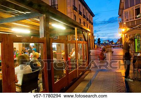 People in a restaurant, night view. Ribadesella, Asturias province, Spain. View Large Photo Image Picture - People in a restaurant, night view. Ribadesella, Asturias province, Spain.. Fotosearch