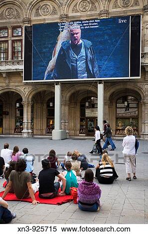 Stock Photography - People listening to the opera on the street, Opera House, Vienna. Austria. Fotosearch