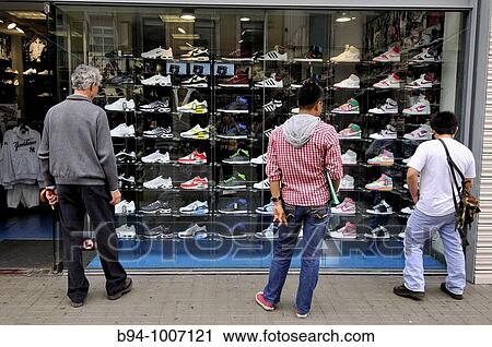 People looking at sneakers shop, Carrer Pelai, Barcelona, Catalonia, Spain View Large Photo Image Stock Image - People looking at sneakers shop, Carrer Pelai, Barcelona, Catalonia, Spain. Fotosearch