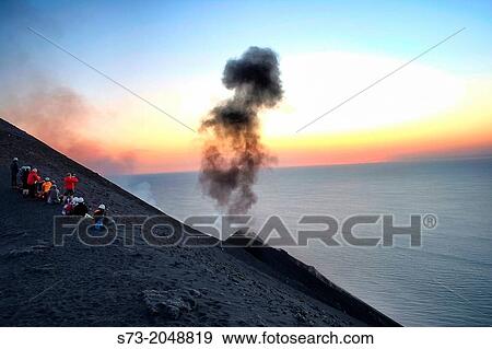 People looking Stromboli volcano eruptions, Sicily, Italy View Large Photo Image Stock Photo - People looking Stromboli volcano eruptions, Sicily, Italy. Fotosearch