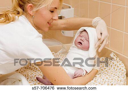 People - nursing sister showing new born baby girl View Large Photo Image Stock Photograph - People - nursing sister showing new born baby girl. Fotosearch