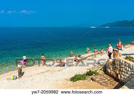 People on a beach in Prigradica village, Korcula island, Croatia. View Large Photo Image Stock Image - People on a beach in Prigradica village, Korcula island, Croatia.. Fotosearch