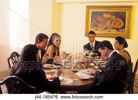 People on dinner table View Large Photo Image Stock Photograph - People on dinner table. Fotosearch