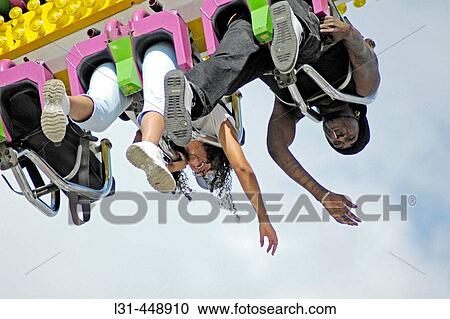 People on local carnival rides for fun during summer vacations at Florida State Fair US View Large Photo Image Stock Image - People on local carnival rides for fun during summer vacations at Florida State Fair US. Fotosearch