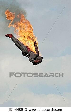 Stock Image - People on local carnival rides for fun during summer vacations at Florida State Fair US fire jumper from 90 feet. Fotosearch