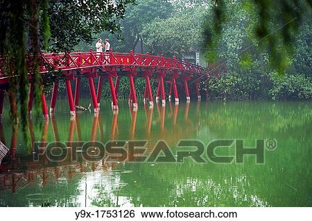 People on the red bridge at the Hoan Kiem Lake in Vietnam View Large Photo Image Stock Photograph - People on the red bridge at the Hoan Kiem Lake in Vietnam. Fotosearch