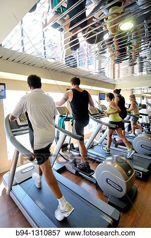 People on treadmills in a gym View Large Photo Image Stock Photo - People on treadmills in a gym. Fotosearch