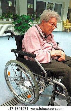Stock Image - people, physical handicap, old age, retirement home, Altenzentrum der St Clemens Hospitale in Sterkrade, older woman sitting in a wheel-chair. Fotosearch