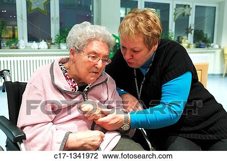 people, physical handicap, old age, retirement home, Altenzentrum der St Clemens Hospitale in Sterkrade, older woman sitting in a wheel-chair View Large Photo Image Stock Image - people, physical handicap, old age, retirement home, Altenzentrum der St Clemens Hospitale in Sterkrade, older woman sitting in a wheel-chair. Fotosearch