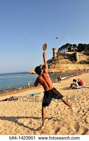 People playing beach tennis, Tossa de Mar (view of the Vila Vella enceinte from the beach), Costa Brava, Girona, Catalonia, Spain View Large Photo Image Stock Image - People playing beach tennis, Tossa de Mar (view of the Vila Vella enceinte from the beach), Costa Brava, Girona, Catalonia, Spain. Fotosearch