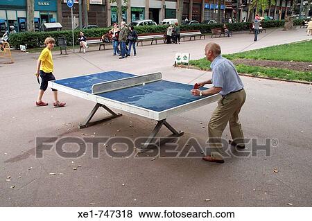 People playing table tennis at Passeig de Sant Joan, Barcelona. Catalonia, Spain View Large Photo Image Stock Photo - People playing table tennis at Passeig de Sant Joan, Barcelona. Catalonia, Spain. Fotosearch