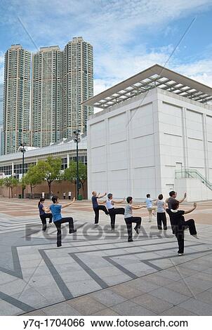 People practicing T? ai Chi in a small group, Kowloon Park, Hong Kong, China View Large Photo Image Stock Photograph - People practicing T? ai Chi in a small group, Kowloon Park, Hong Kong, China. Fotosearch