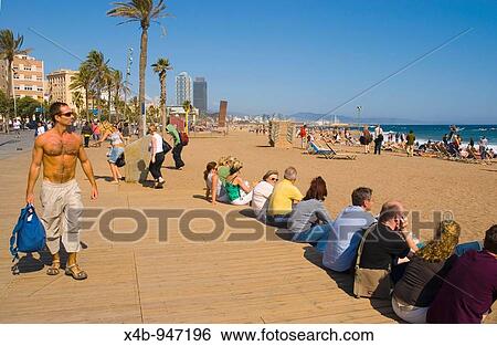 People relaxing at Platja de la Barceloneta beach in Barcelona Spain Europe View Large Photo Image Stock Photograph - People relaxing at Platja de la Barceloneta beach in Barcelona Spain Europe. Fotosearch