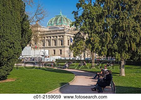 People relaxing in park and National University library Strasbourg Alsace France. View Large Photo Image Stock Photo - People relaxing in park and National University library Strasbourg Alsace France.. Fotosearch
