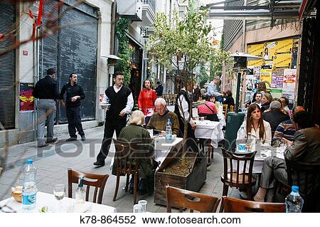 People sitting at a outdoors cafe near Istiklal street, Istanbul, Turkey View Large Photo Image Stock Image - People sitting at a outdoors cafe near Istiklal street, Istanbul, Turkey. Fotosearch