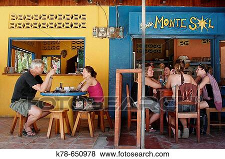People sitting at a restaurant in Montezuma, Nicoya peninsula, Costa Rica. View Large Photo Image Stock Photo - People sitting at a restaurant in Montezuma, Nicoya peninsula, Costa Rica.. Fotosearch