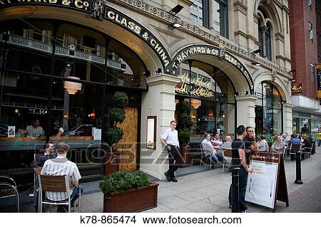 People sitting at restaurant on Deansgate, Manchester, England, UK View Large Photo Image Picture - People sitting at restaurant on Deansgate, Manchester, England, UK. Fotosearch