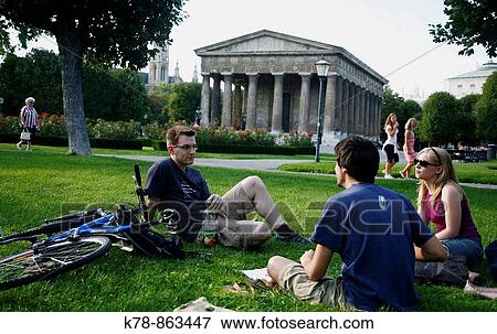 People sitting at Volksgarten park with the Temple of Theseus in the background, Vienna, Austria View Large Photo Image Stock Photo - People sitting at Volksgarten park with the Temple of Theseus in the background, Vienna, Austria. Fotosearch